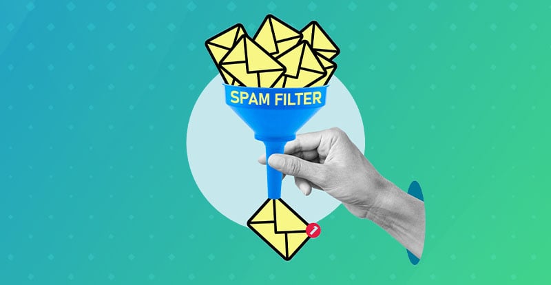 Letters going through a spam filter with hand holding it