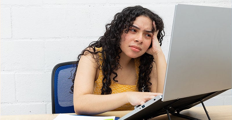 Frustrated woman in front of computer