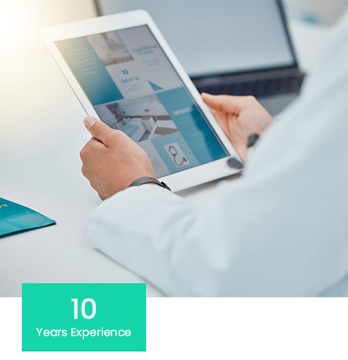 doctor using a tablet. text that reads 10 year experience.