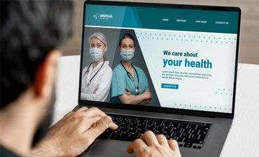 person on laptop browsing medical website