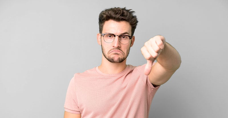 Man with thumbs down